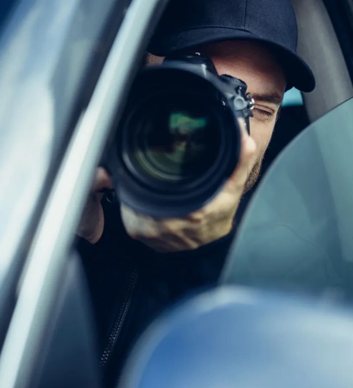 Photographer taking pictures from car